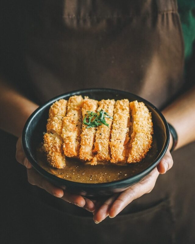 fried dish on round black plate