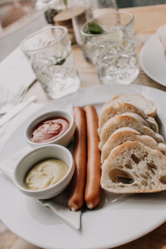 bread with white cream on white ceramic plate